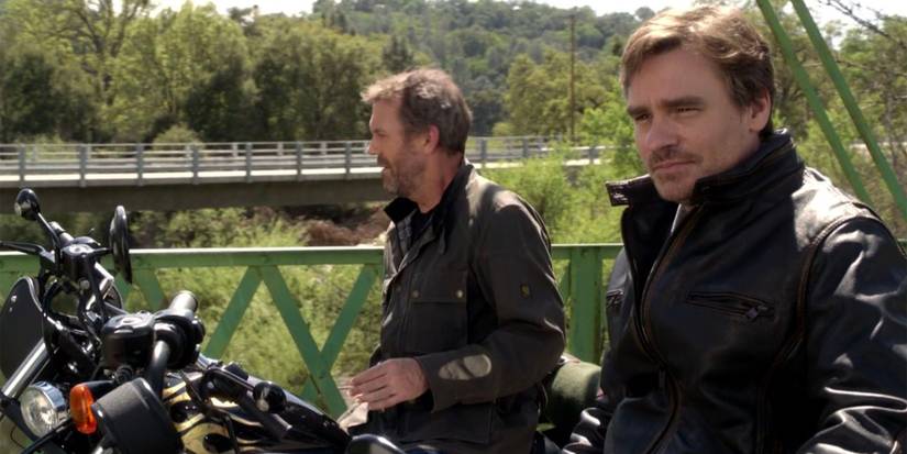 House (Hugh Laurie) and Wilson (Robert Sean Leonard) riding their bikes in House, M.D.'s finale.