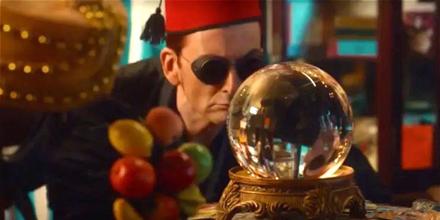 Crowley wearing a fez and looking at a crystal ball in Good Omens