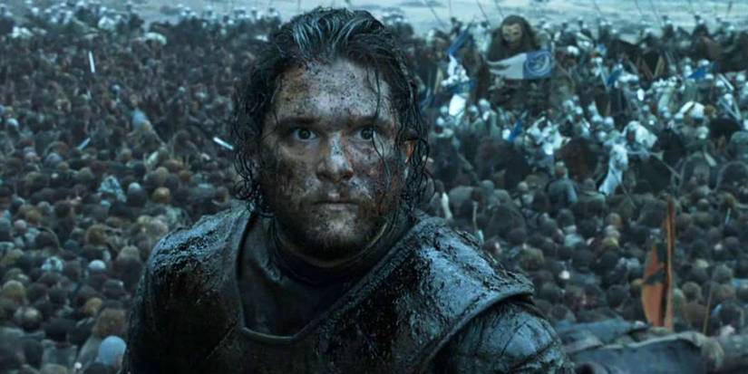 Kit Harington covered in blood during a battle sequence in Game of Thrones.