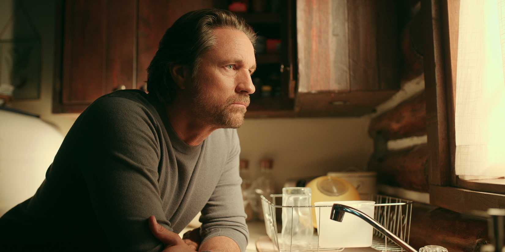 Martin Henderson in Virgin River season 5 looking out a window