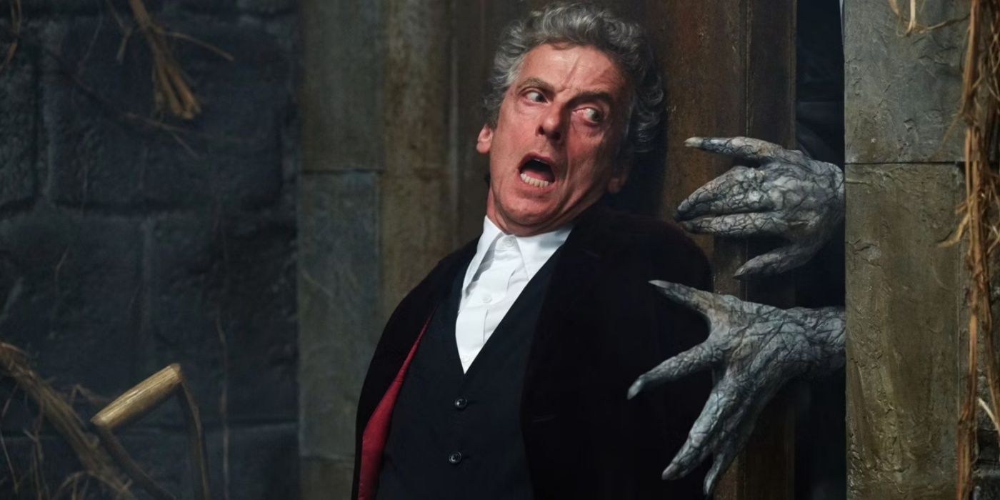 Peter Capaldi as the Twelfth Doctor, escaping from a monster's hands in Doctor Who.
