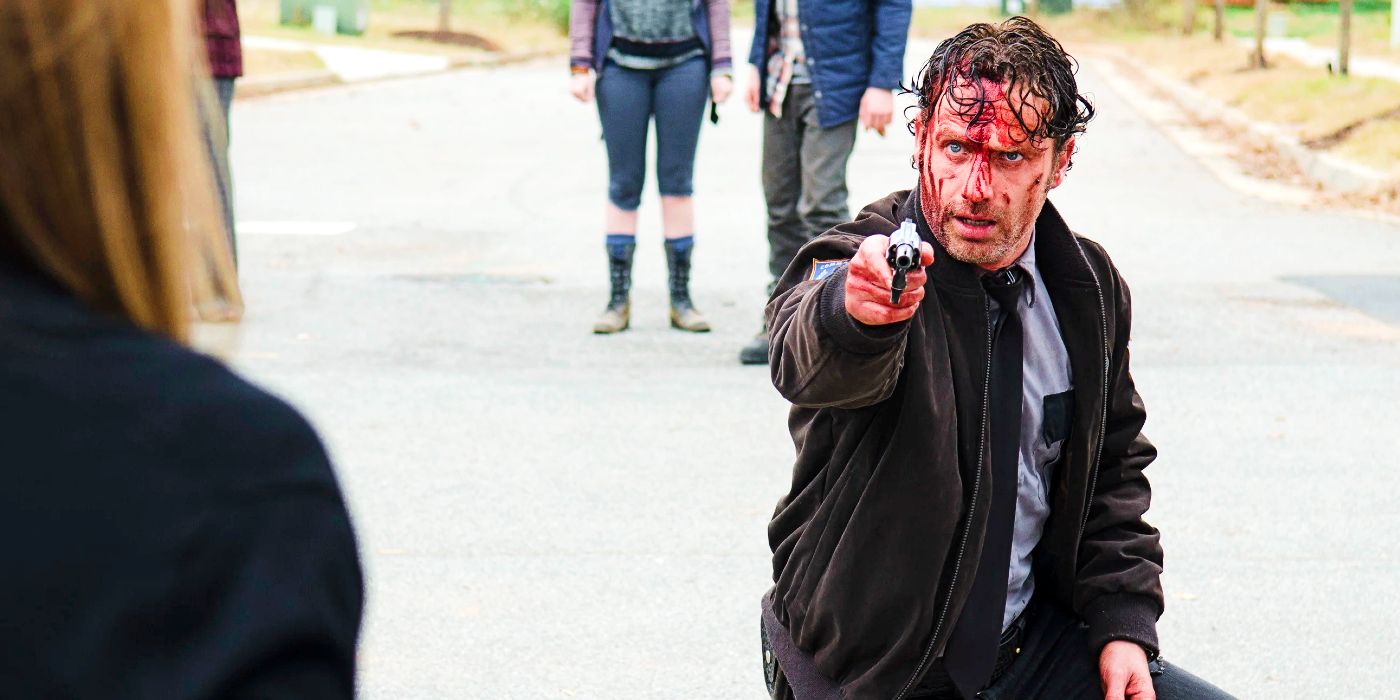 Rick Grimes (Andrew Lincoln) in pointing a gun in The Walking Dead season 5 Alexandria arc