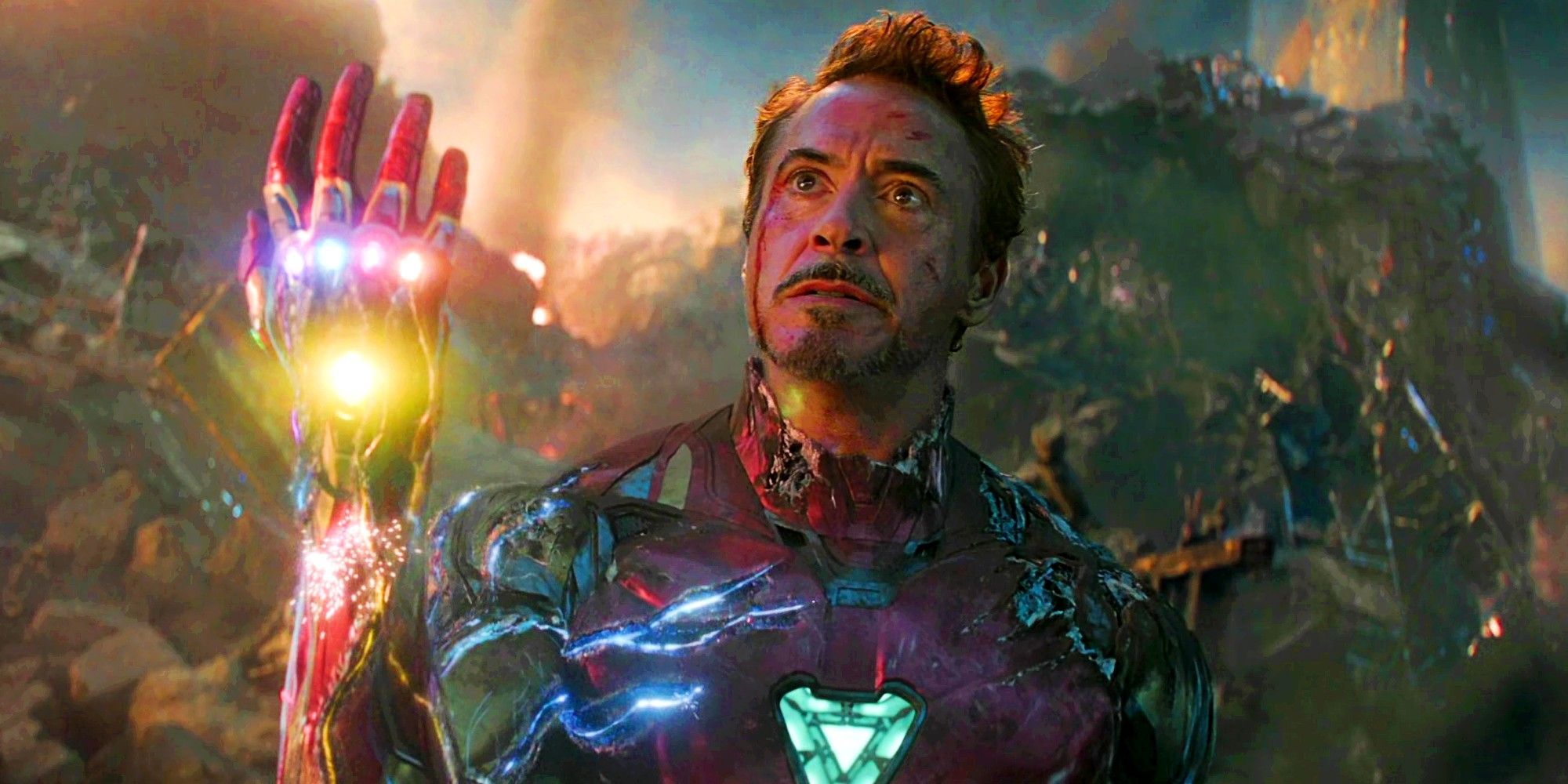 Robert Downey Jr as Tony Stark Iron Man in Avengers Endgame holding the infinity gauntlet