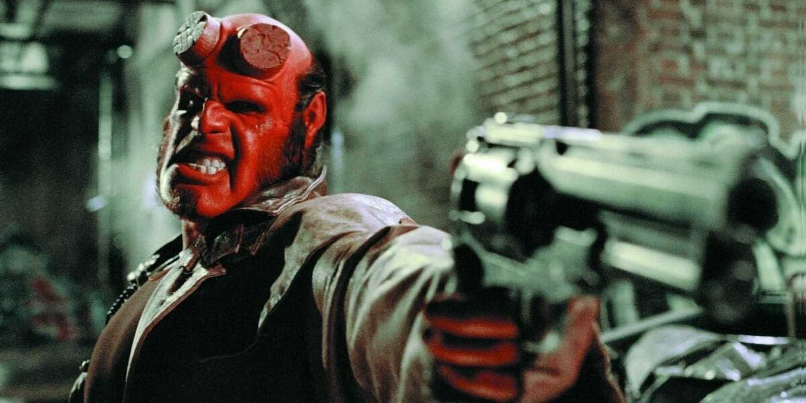 Ron Perlman as Hellboy aiming a gun