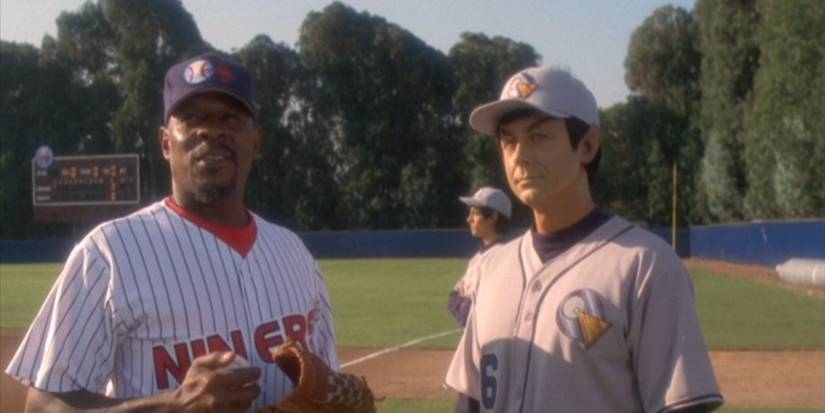Sisko and Solok stand together on the holosuite in baseball uniforms in the Star Trek: Deep Space Nine episode "Take Me Out to the Holosuite"