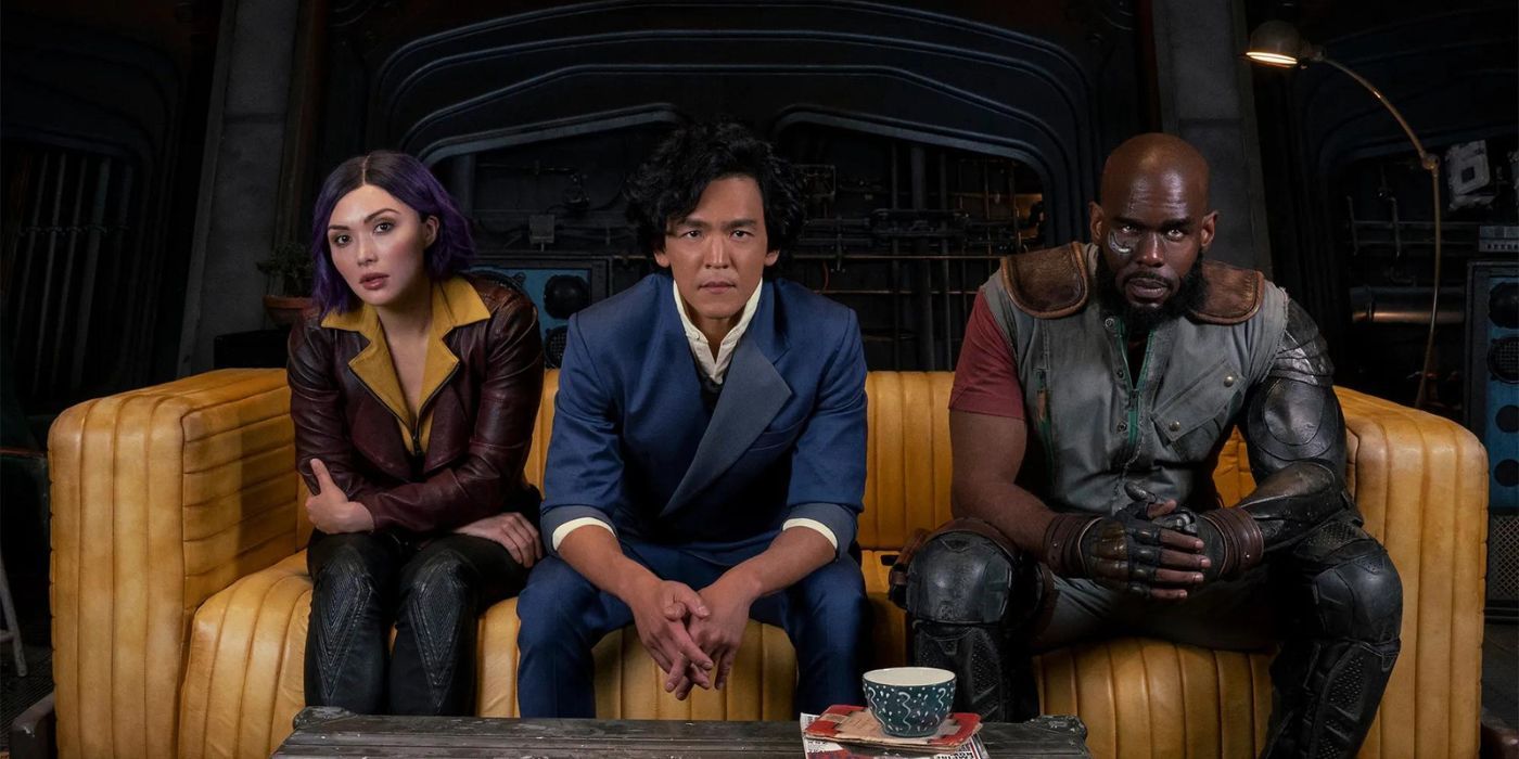 Spike, Faye and Jet Black sitting on a sofa together in Cowboy Bebop