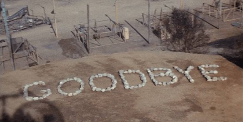 The goodbye message written with stones on the ground in the MASH finale, “Goodbye, Farewell and Amen.”