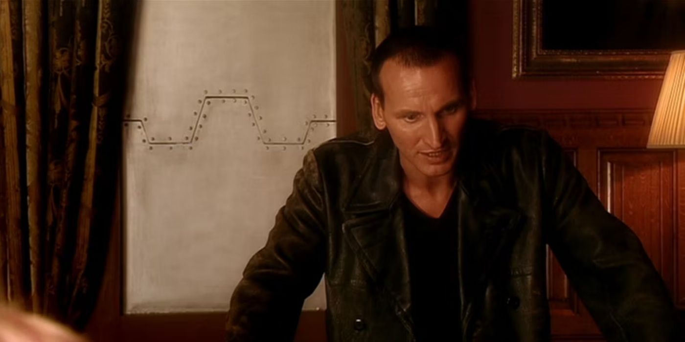 Christopher Eccleston as the Ninth Doctor looking distressed in Doctor Who