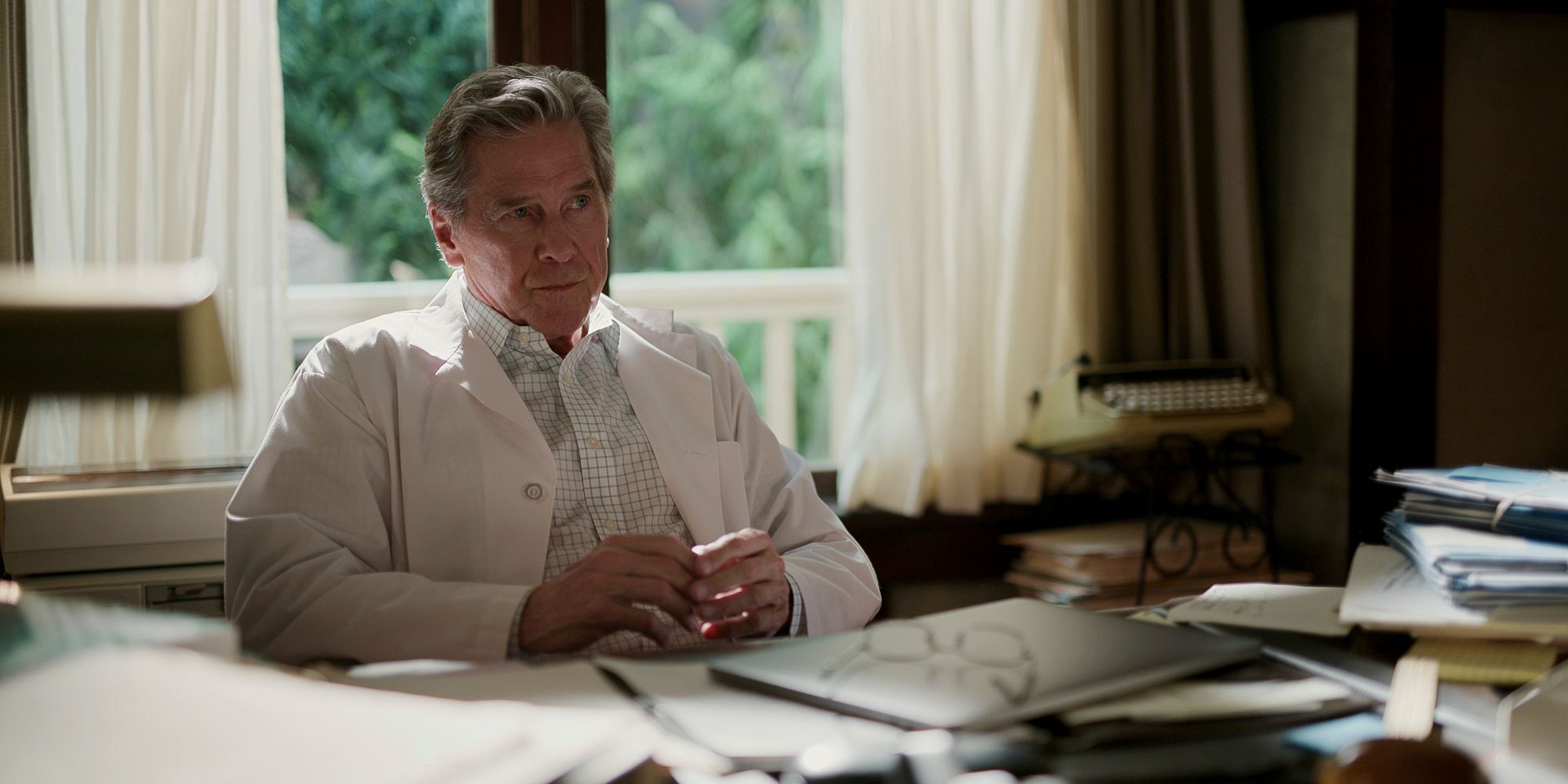 Tim Matheson in Virgin River season 5 behind a desk