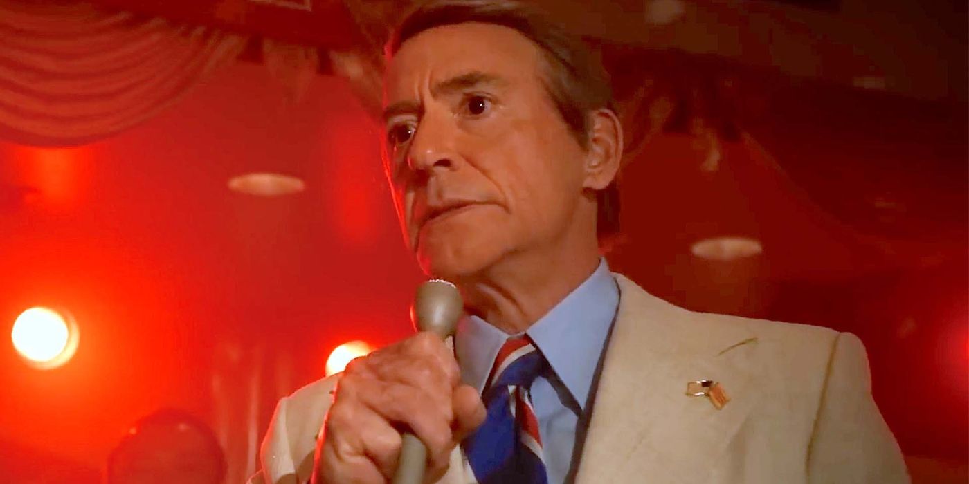 An image of Robert Downey Jr. speaking into a microphone in The Sympathizer
