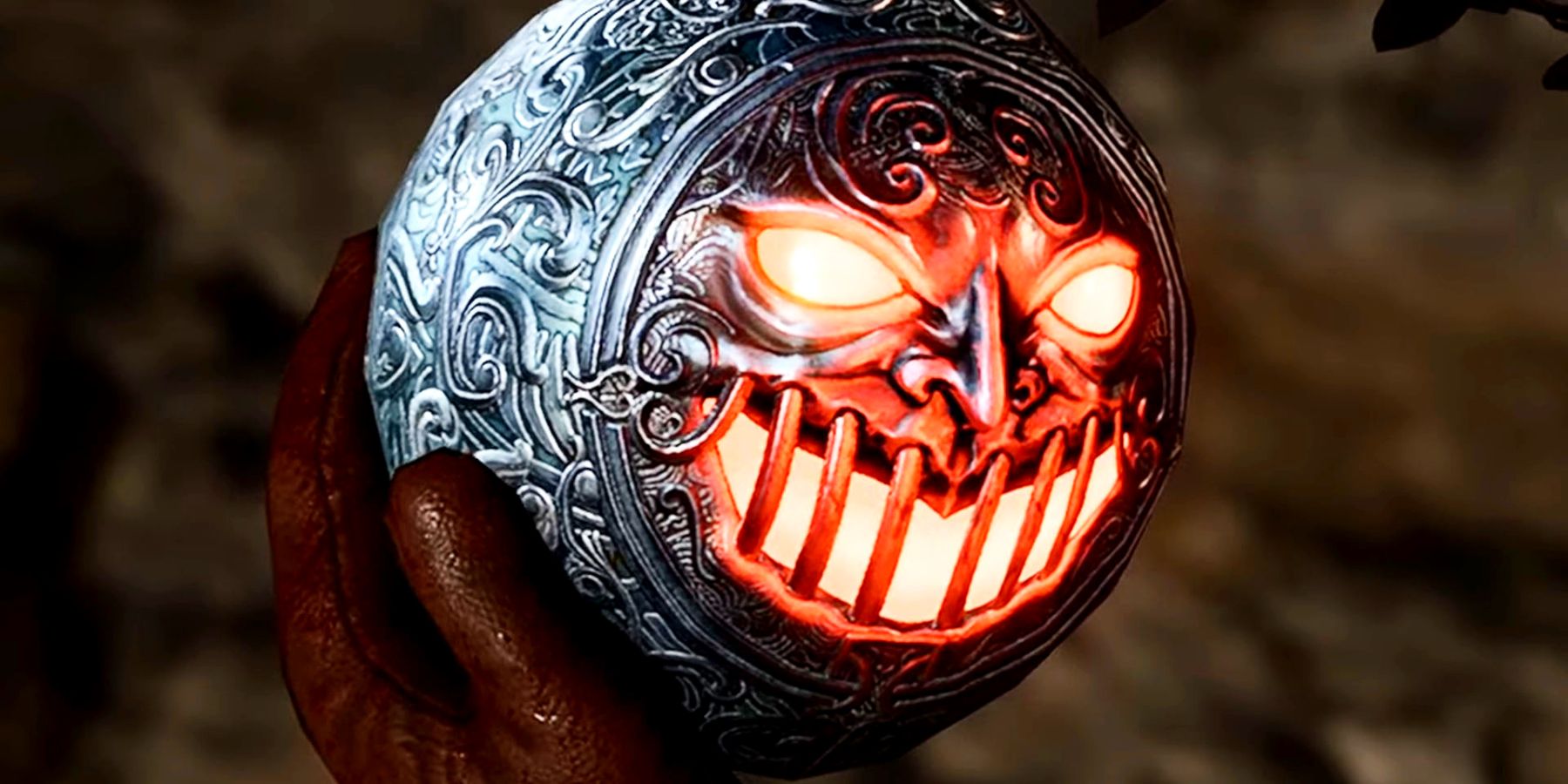 A close-up on an item known as the Iron Flask in Baldur's Gate 3 as it's held in someone's gloved hand. The iron of the flask has ornate engravings, and one side is covered in a pattern that looks like a glowering face, the eyes and mouth glowing bright red.
