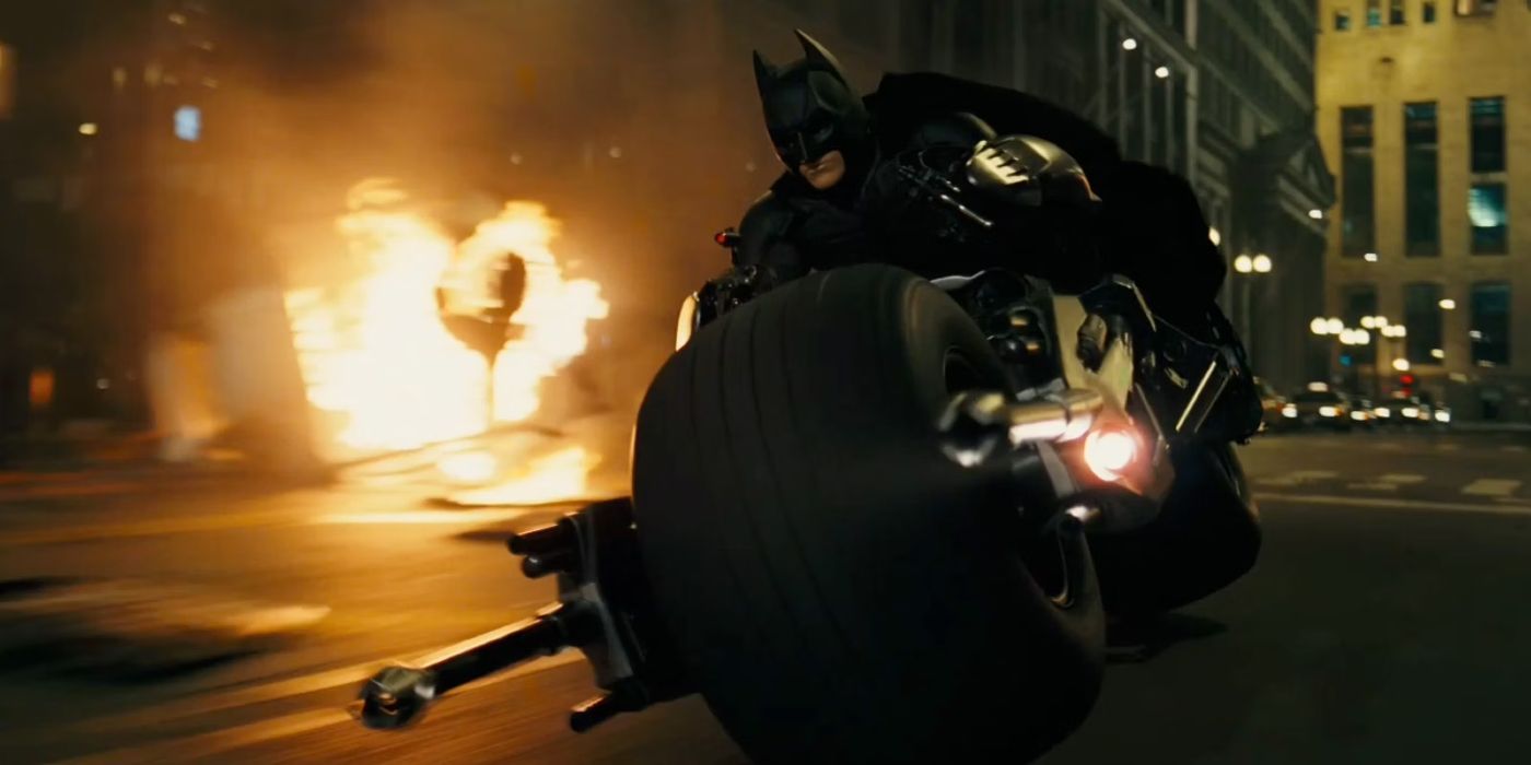 Christian Bale as Batman riding the Batpod in The Dark Knight (2008)
