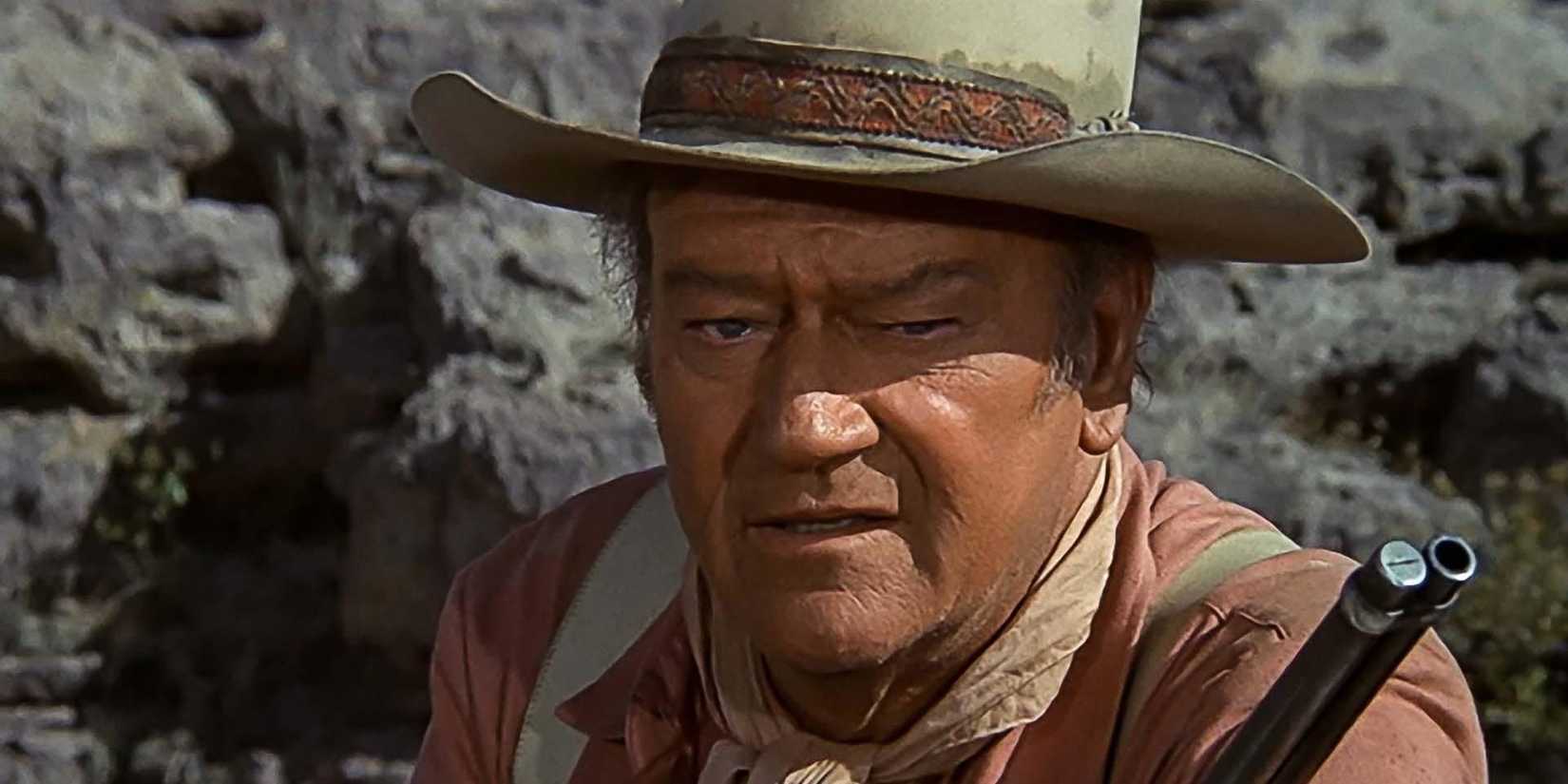 John Wayne segurando um rifle em Big Jake
