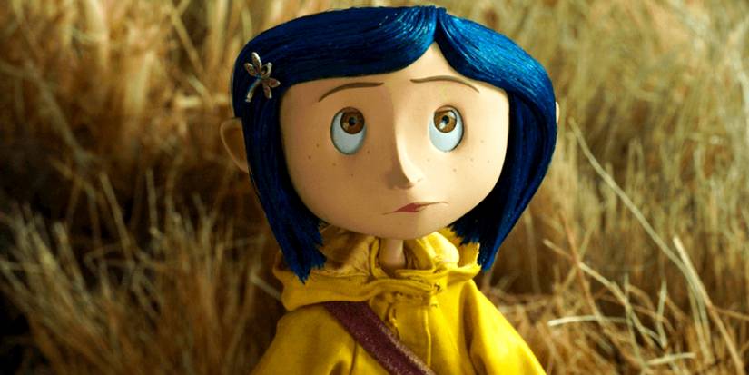Dakota Fanning as Coraline Jones wears a yellow raincoat in a scene from Coraline.