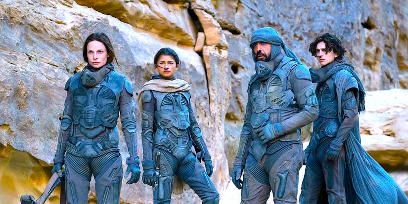 Rebecca Ferguson, Zendaya, Javier Bardem and Timotee Chalamet standing in front of rocks in Dune 1.