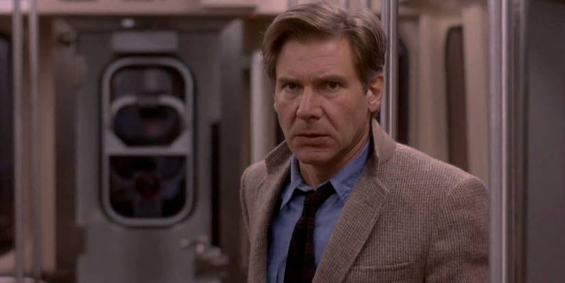 Harrison Ford as Richard Kimble on a train in The Fugitive.