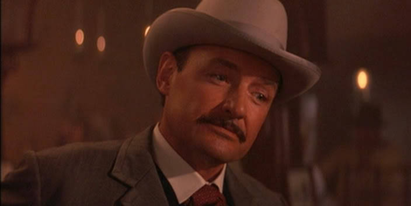 Terry O'Quinn as John Clum in Tombstone