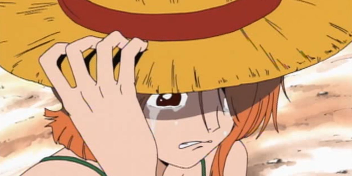 Nami-from-One-Piece-wearing-Luffy's-straw-hat-and-crying