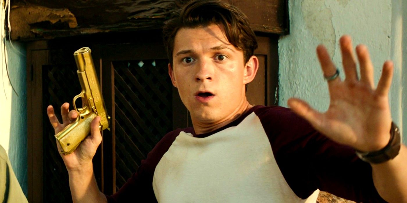 Tom Holland as Nathan Drake holding up a golden gun and putting his hands up in the Uncharted post credit scene