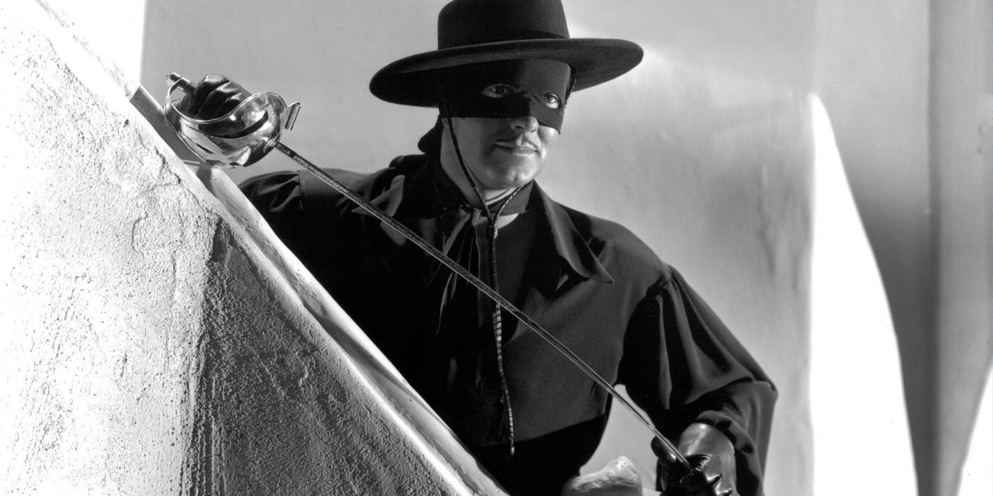 Tyrone Power segurando uma espada e olhando atentamente em A Marca do Zorro (1)