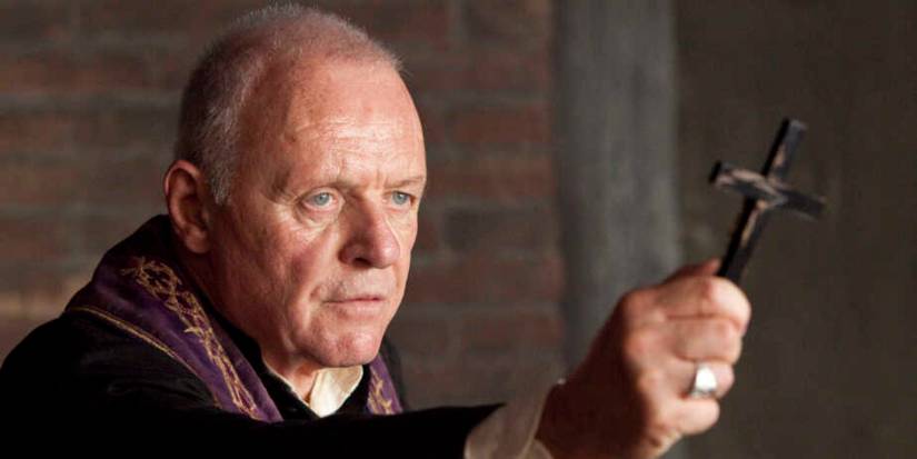Anthoyn Hopkins as Father Lucas in The Rite holding out a cross