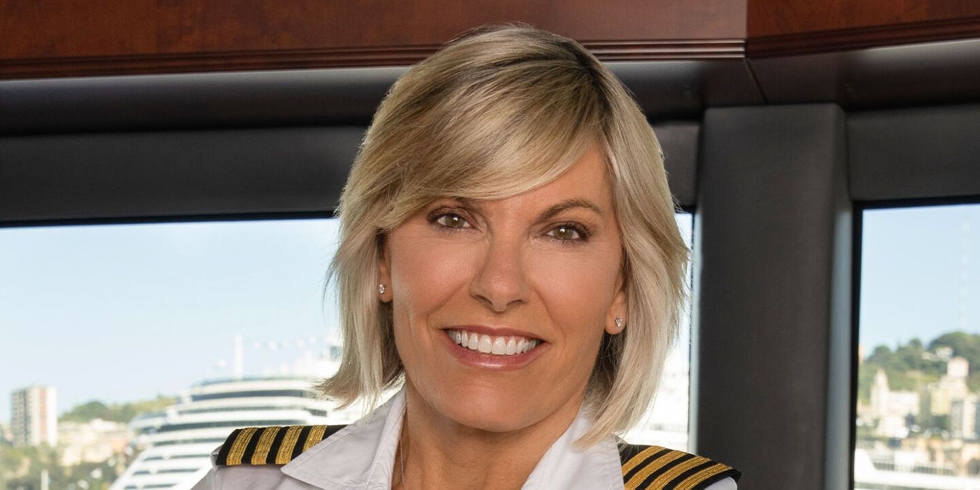 Captain Sandy Below Deck Med Smiling in a white uniform with blonde hair