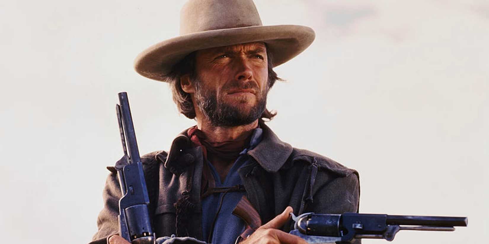 Clint Eastwood as Josey Wales with two guns in The Outlaw Josey Wales