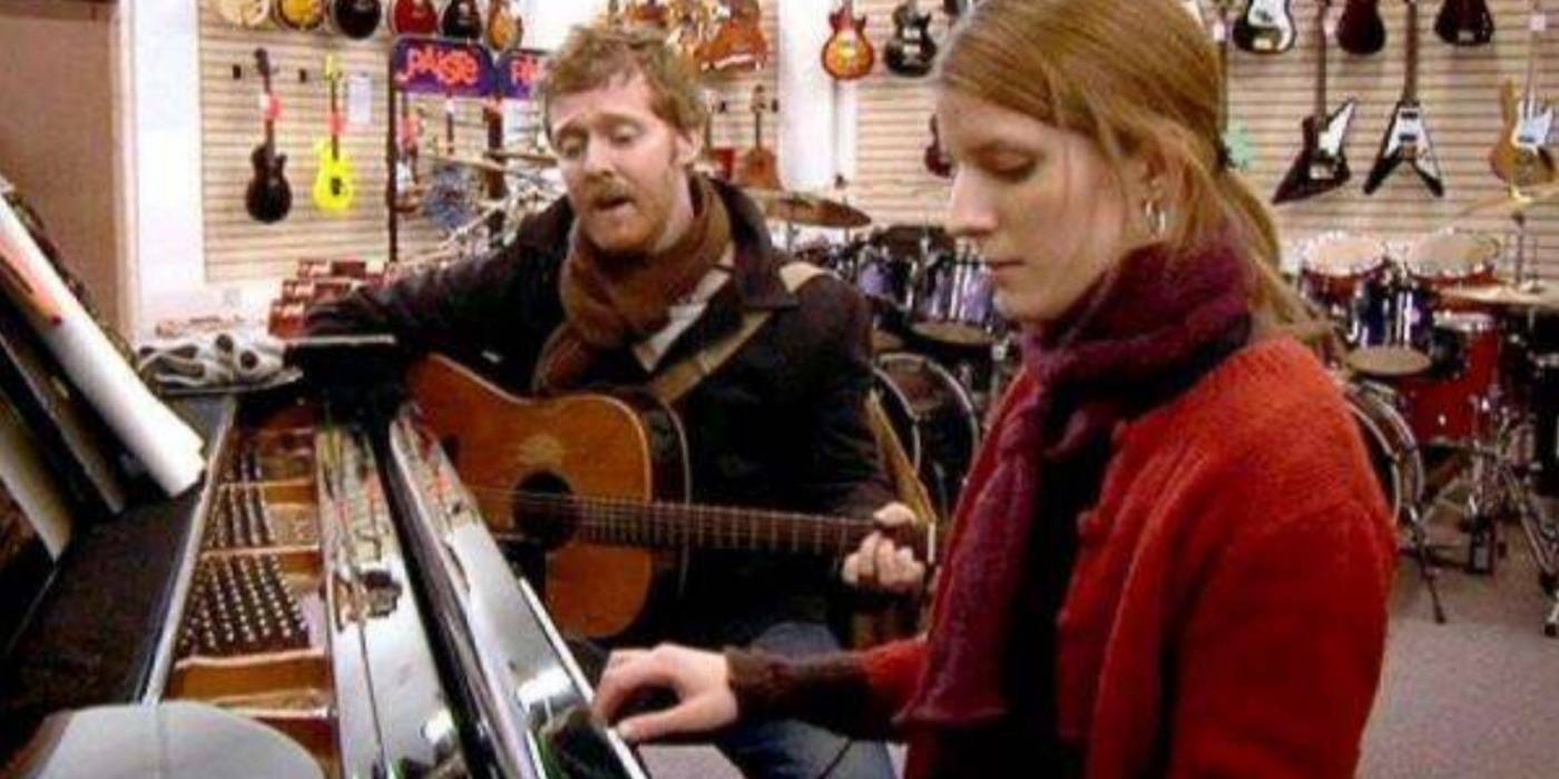 Guy and Girl singing in Once
