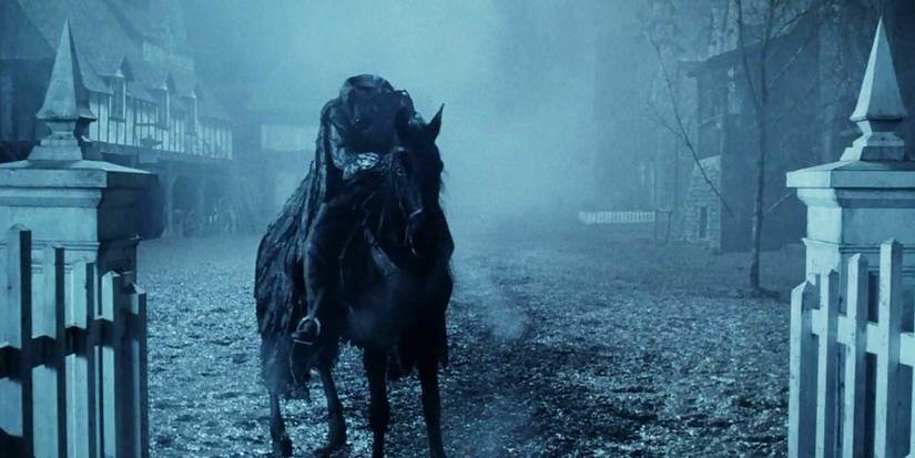 The Headless Horseman riding a horse into the cemetary in Sleepy Hollow.