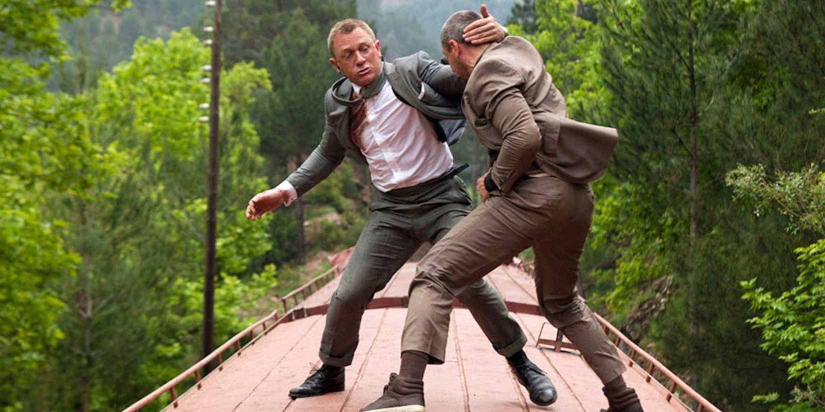 James Bond (Daniel Craig) fighting on a speeding train in Skyfall