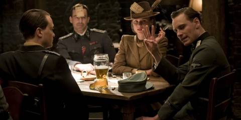 Several characters play a game at a tavern in Inglourious Basterds