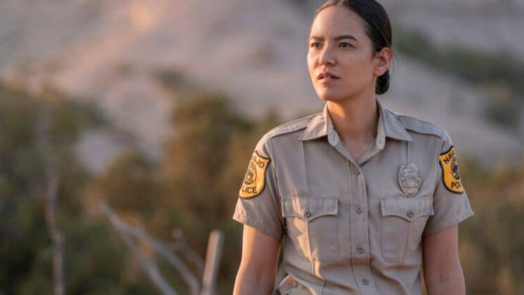 Jessica Matten as Bernadette Manuelito standing outdoors in Dark Winds.