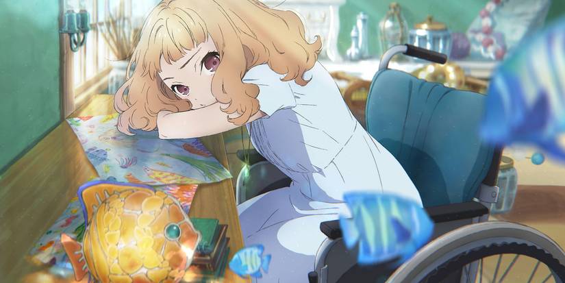 Josee, the Tiger and the Fish image of Josee lying her arms on a table while sitting in her wheelchair