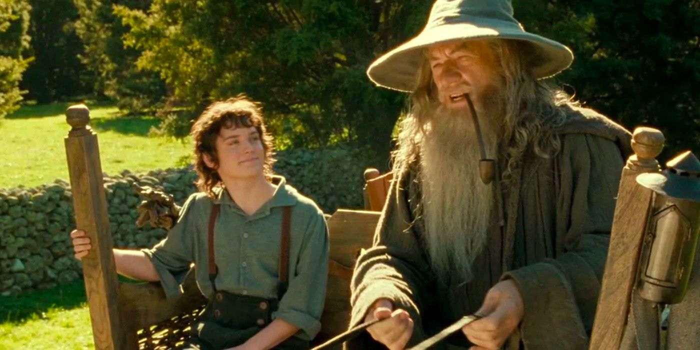 Frodo and Gandalf sitting on a bench in Lord of the Rings the Fellowship of the Ring