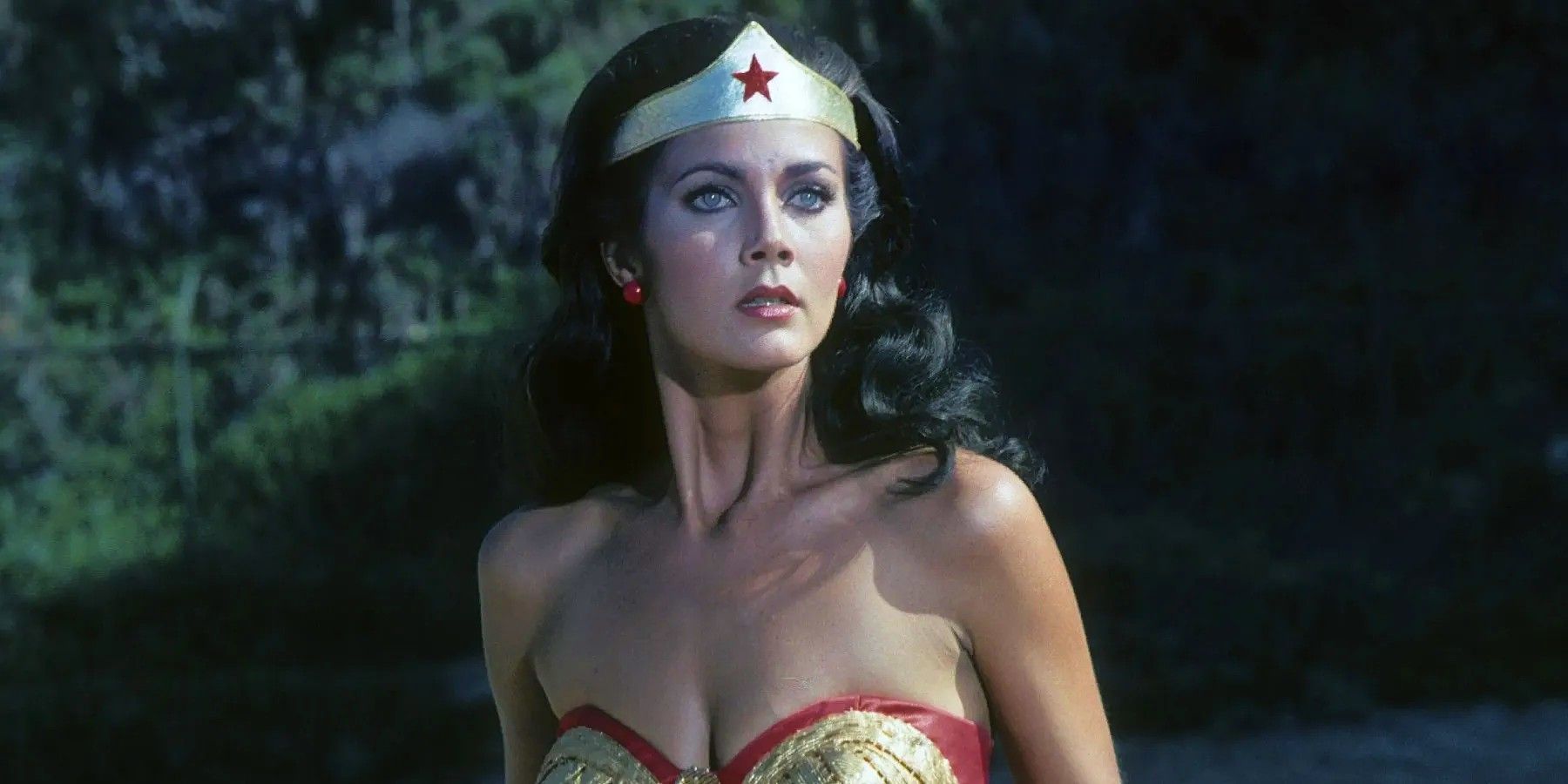 Lynda Carter as Wonder Woman looking offscreen