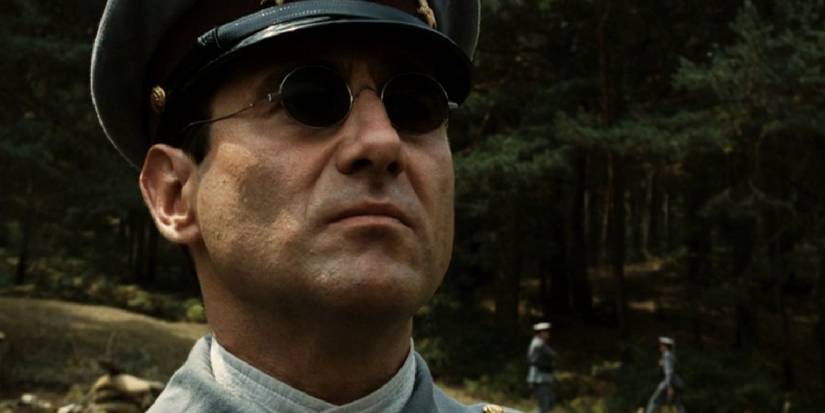 Sergi Lopez as Vidal in Pan's Labyrinth staring ahead wearing glasses