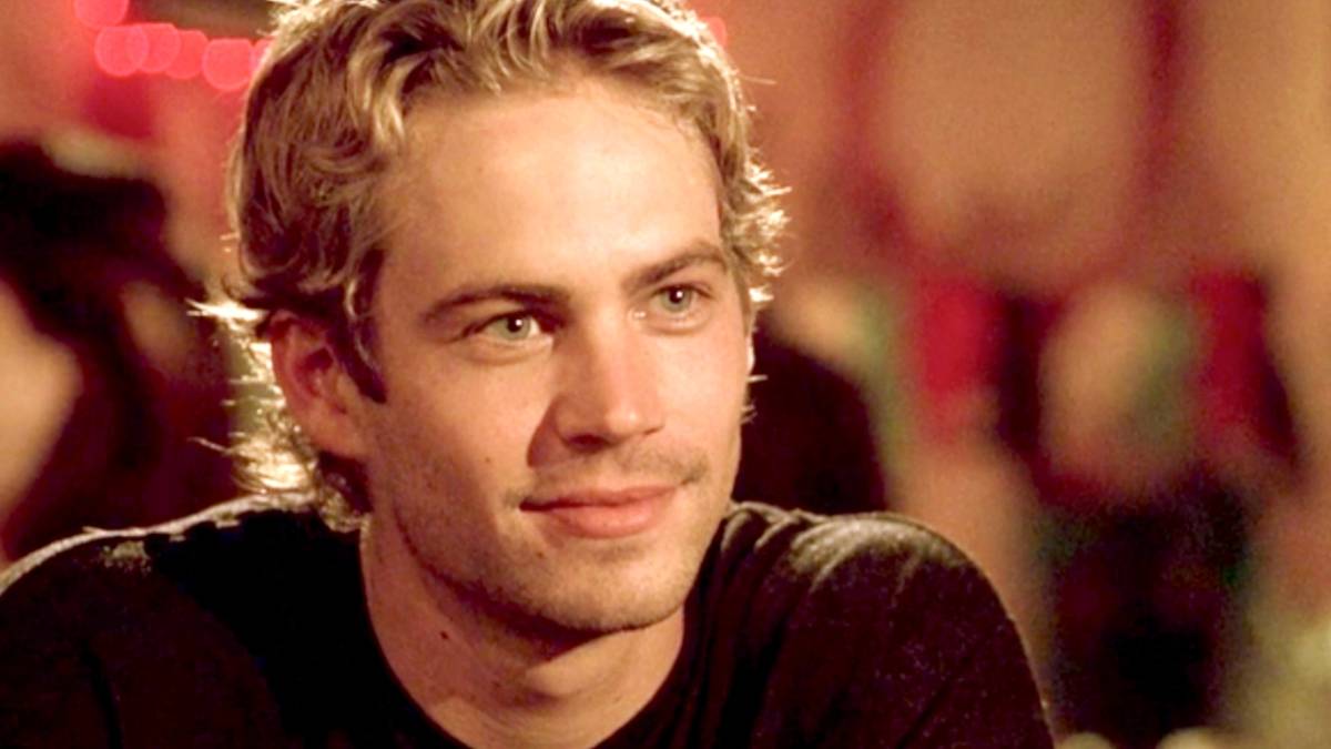 Paul Walker smiling as Brian O'Conner in Fast and Furious.