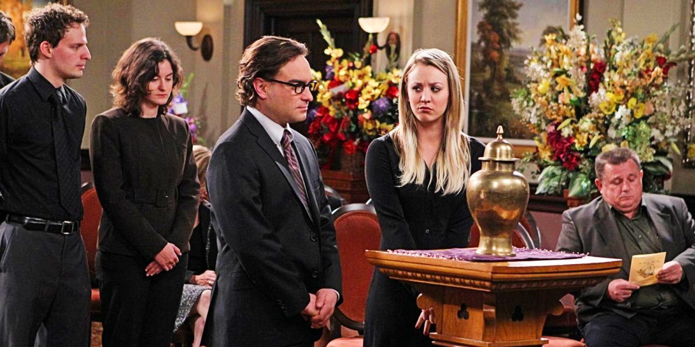 Kaley Cuoco's Penny and Johnny Galecki's Leonard standing at a funeral in The Big Bang Theory