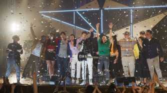 The Power Rangers celebrating on a stage at the end of Cosmic Fury