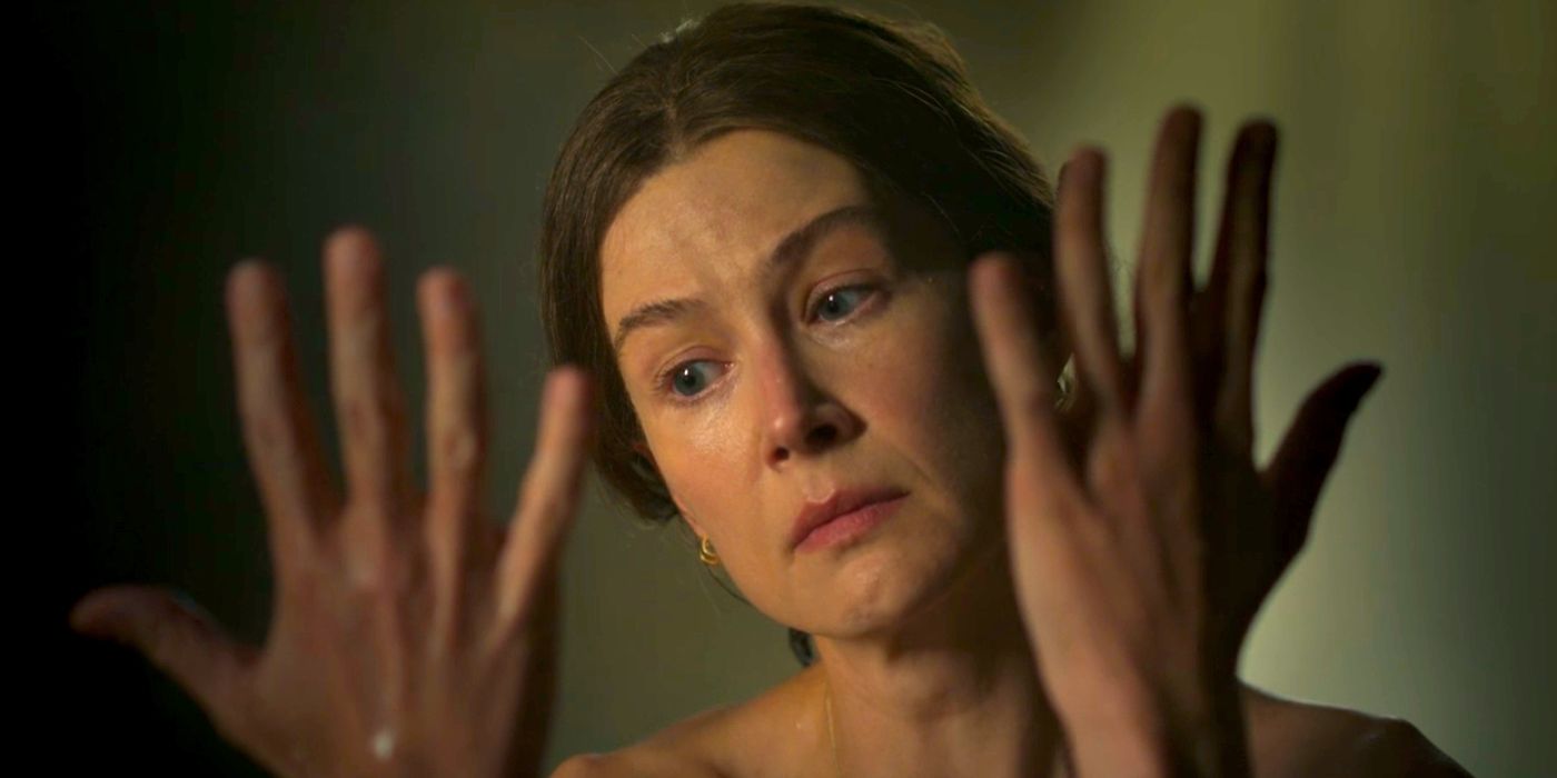 Rosamund Pike as Moiraine Looking at Her Hands in The Wheel of Time Season 2