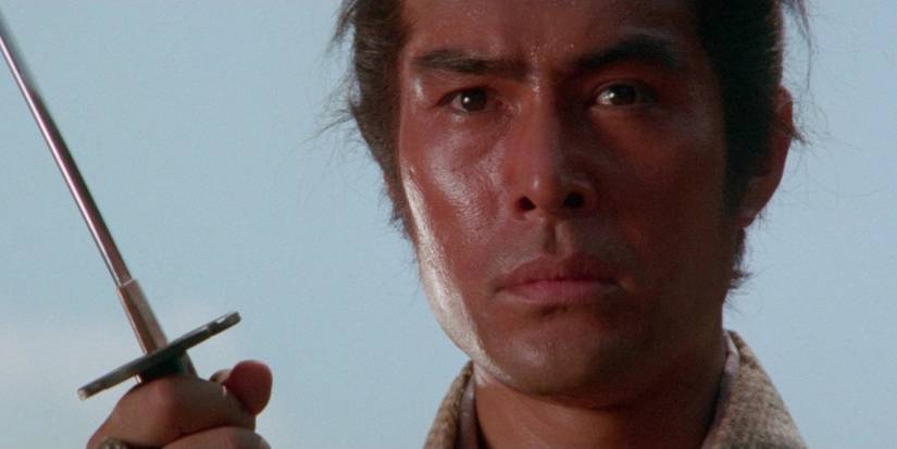 A samurai holds up his sword in Lone Wolf and Cub: Baby Cart To Hades