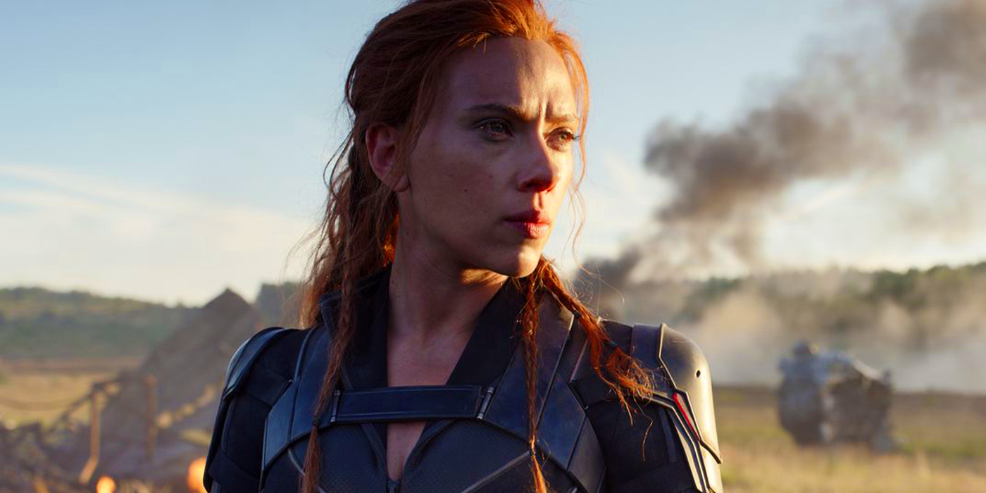 Scarlett Johansson as Natash Romanoff, standing among rubble and smoke in the MCU's Black Widow