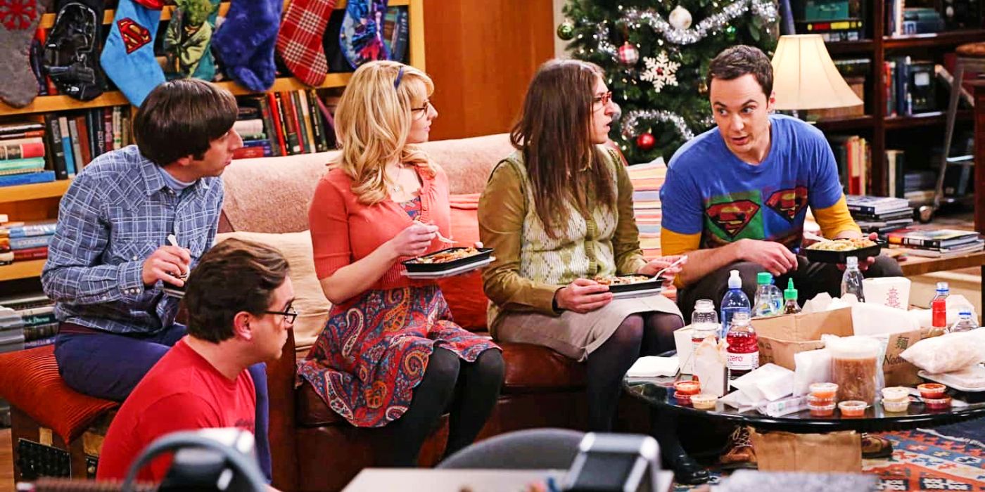 Johnny Galecki as Leonard, Melissa Rauch as Bernadette, Jim Parsons as Sheldon, Mayim Bialik as Amy, and Simon Helberg as Howard sitting on a couch in The Big Bang Theory's The Holiday Summation