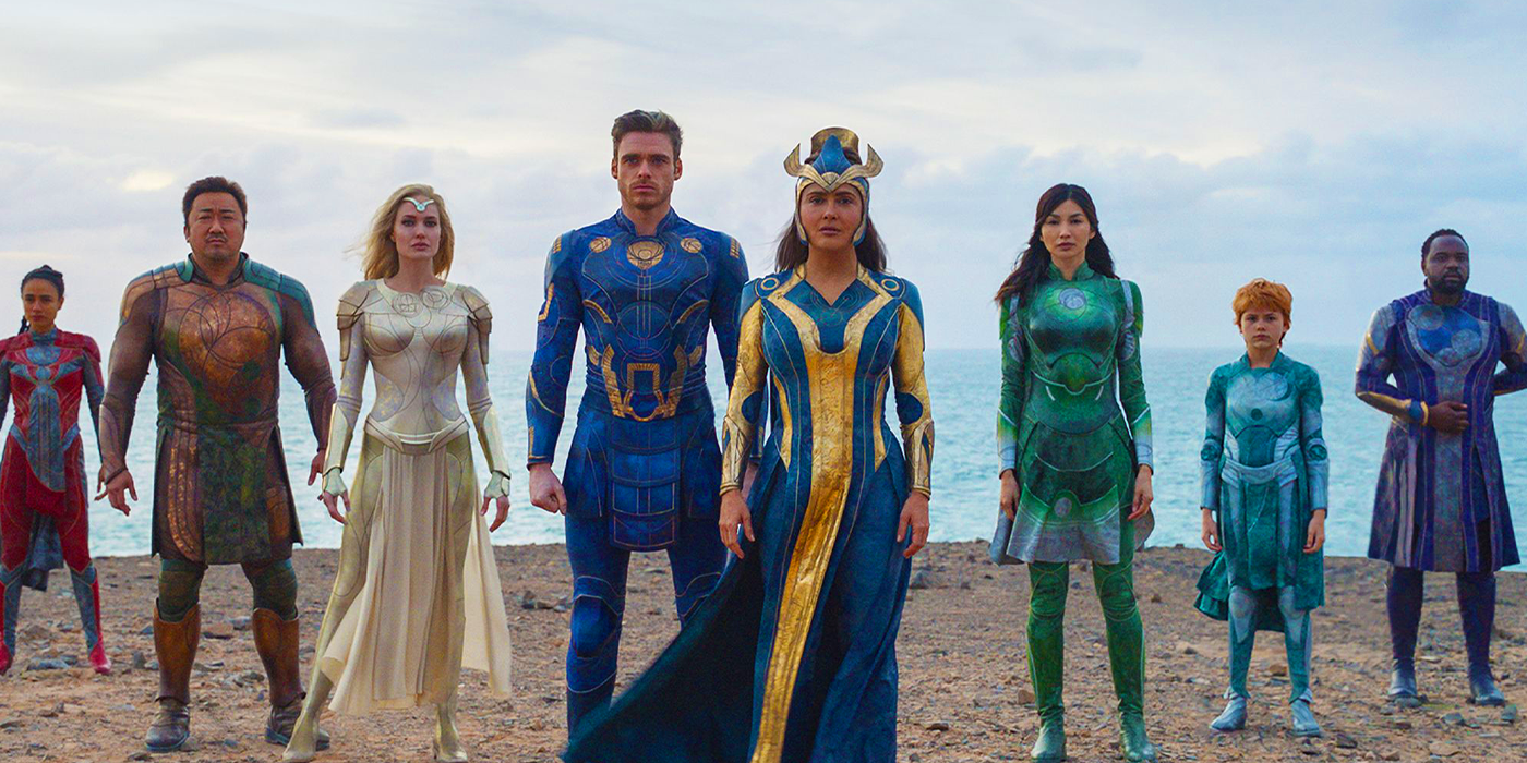 The Eternals stand in a line on a beach in their MCU Phase 4 movie