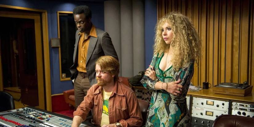 three characters behind a mixing table in vinyl