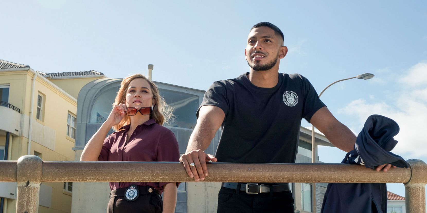 Tuuli Parker and Sean Sagar at a railing in NCIS Sydney