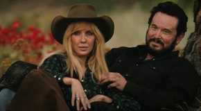 Beth (Kelly Reilly) and Rip cuddling by a tree in Yellowstone