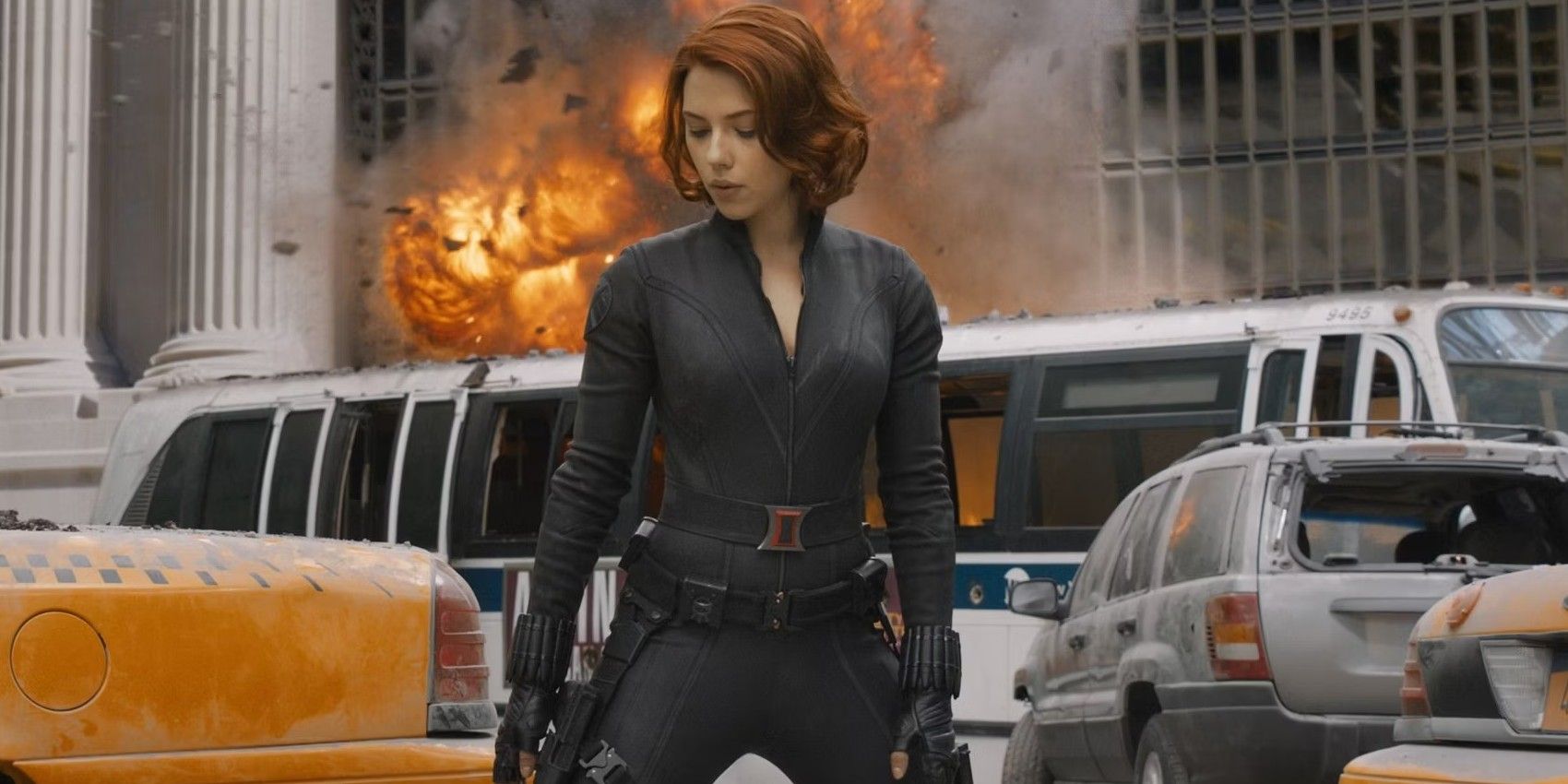 Black Widow in The Avengers as an explosion goes off behind her.