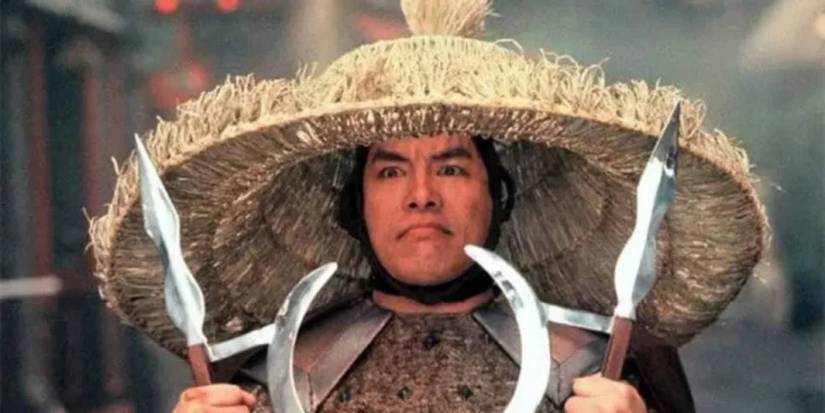 Carter Wong's 10 Best Martial Arts Movies, Ranked 8 Carter Wong as Thunder holding up swords in Big Trouble in Little China.