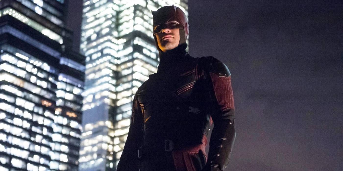 Daredevil stands on a rooftop listening to the sounds of Hell's Kitchen in Netflix's Daredevil